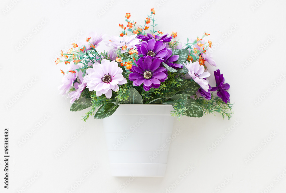 Artificial flowers in the wall. Artificial flowers in the wall.
