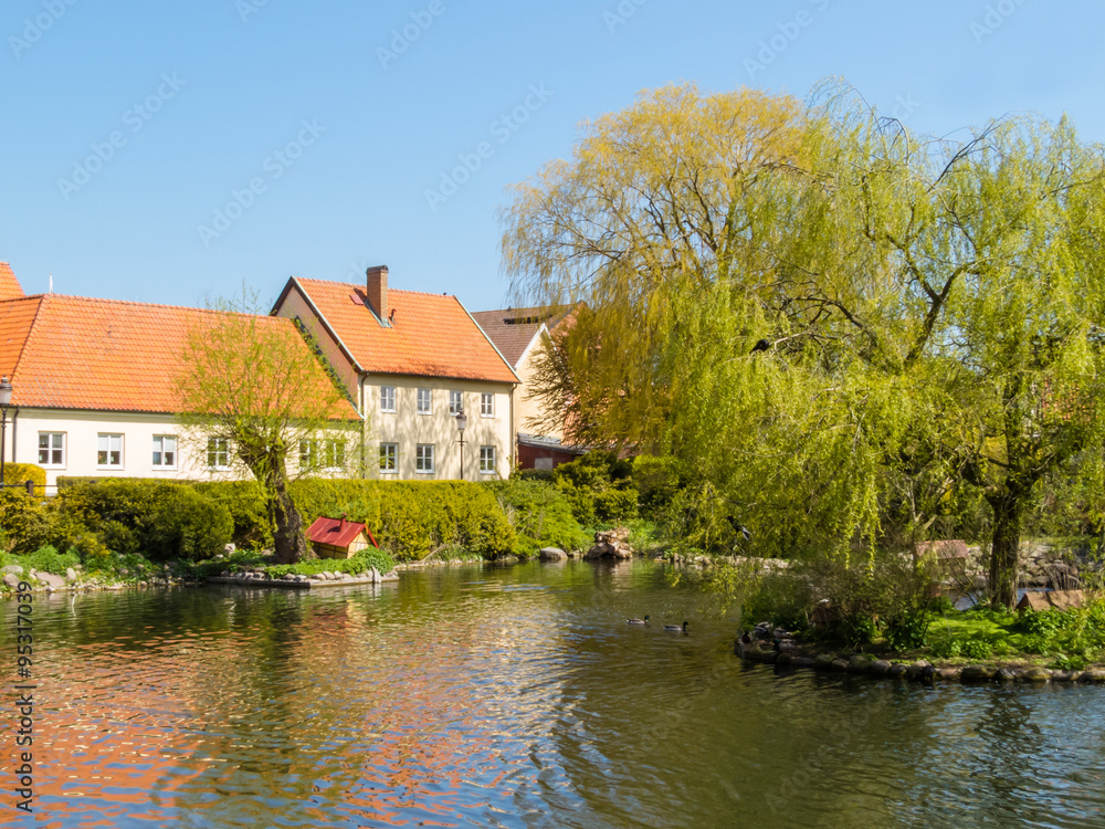 Old house and pond in rural Sweden