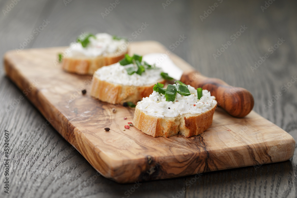 crunchy baguette slices with cream cheese and green onion crunchy baguette slices with cream cheese and green onion