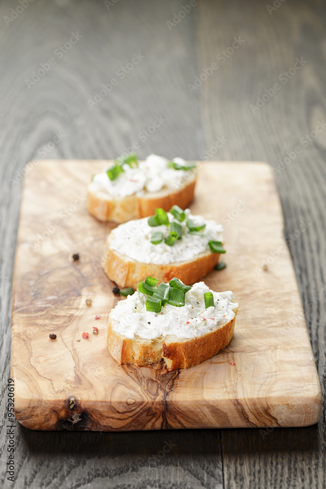 crunchy baguette slices with cream cheese and green onion crunchy baguette slices with cream cheese and green onion