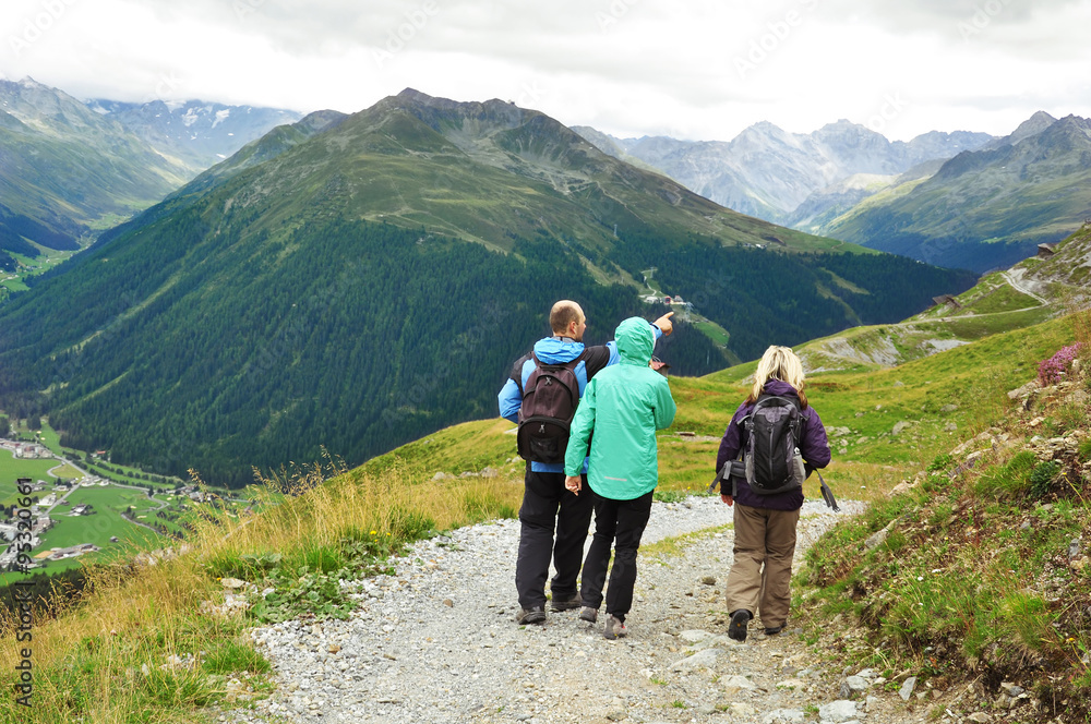 Tourists hiking in mountains