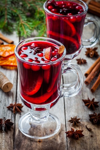 homemade mulled wine with orange slices, cranberries, cinnamon and anise