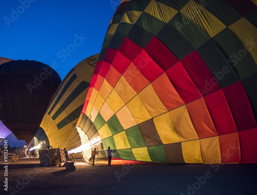 Fototapet Hot air balloons being filled at dawn