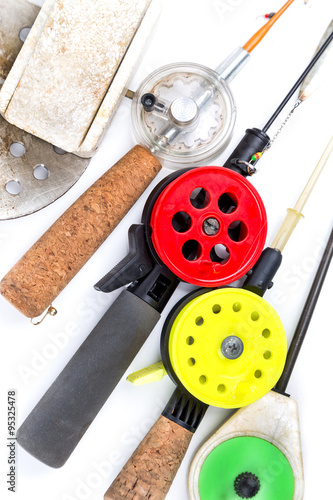 closeup ice-fishing rods and equipment photo