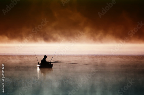 Lone fisherman in boat