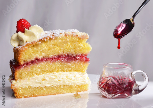 Bild auf Leinwand Home-made Victoria Sponge cake with raspberry jam and fresh cream