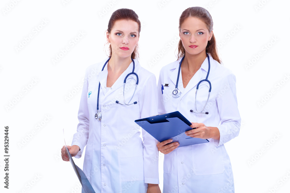 Two woman nurse watching X Ray image, standing in hospital Two woman nurse watching X Ray image, standing in hospital