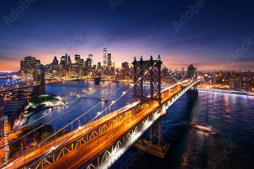 New York City - beautiful sunset over manhattan with manhattan and brooklyn bridge © dell