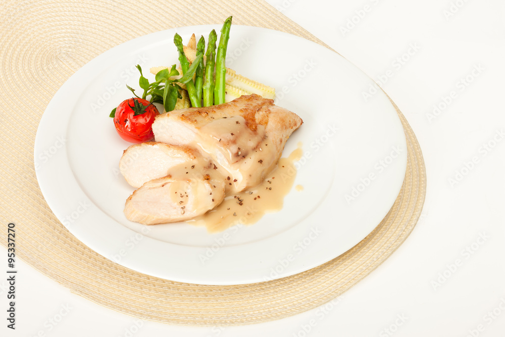 Fried chicken fillet in white cream sauce