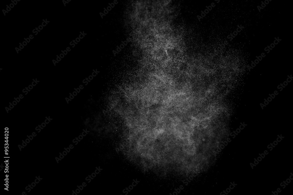Obraz premium abstract splashes of water on a black background. splashes of milk. abstract spray of water. abstract rain. shower water drops. white dust explosion. abstract texture. abstract black background.