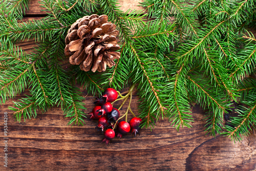 Christmas background with spruce branches on wooden board Christmas background with spruce branches on wooden board