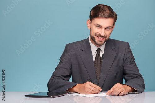 Attractive young tv reporter preparing for discussion