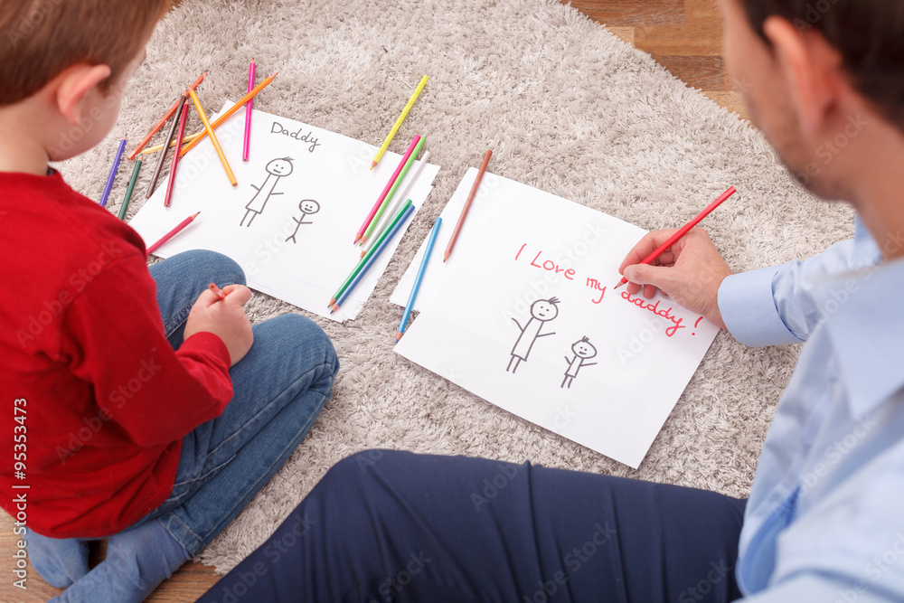 Cheerful parent is spending time with his child Cheerful parent is spending time with his child