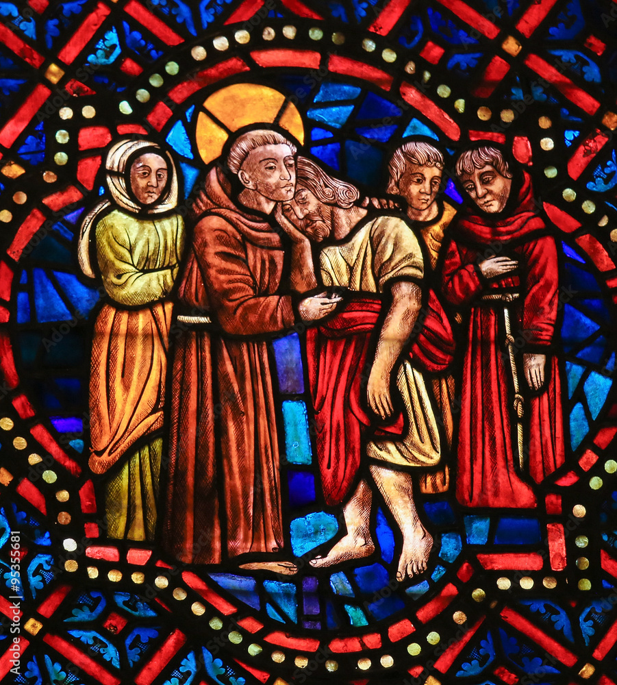 Stained Glass of a Christian Saint hugging Christ in Cathedral o