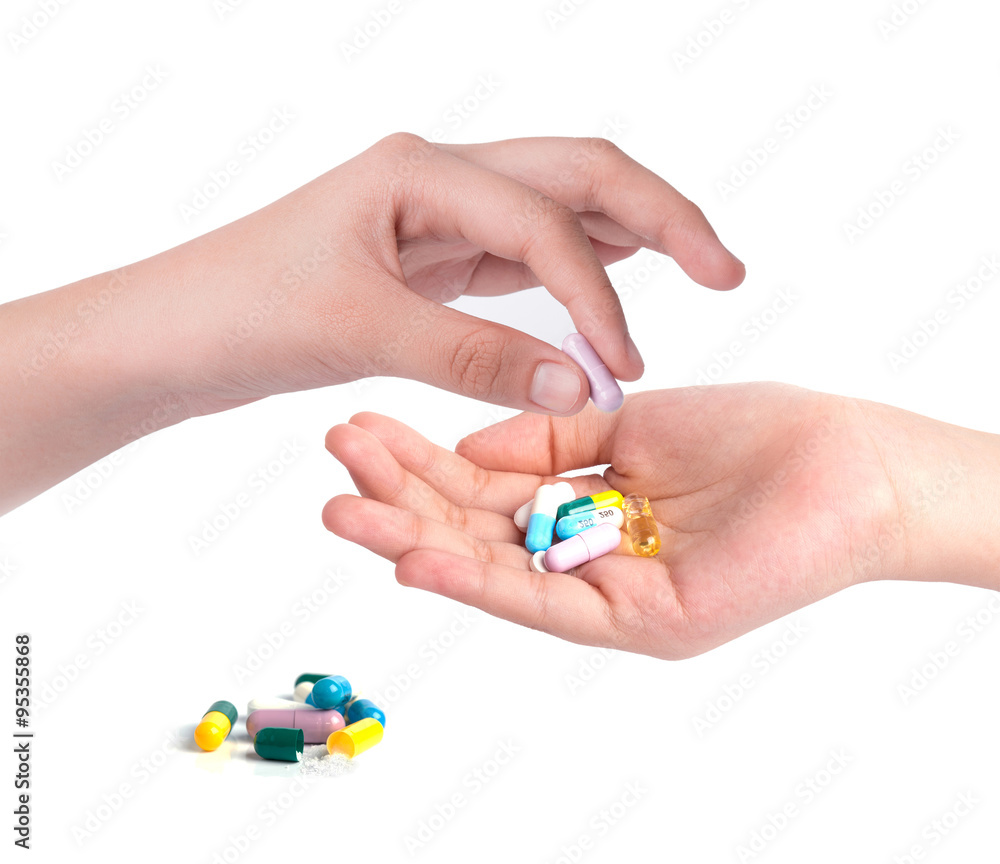 Drug capsules and pills in hand