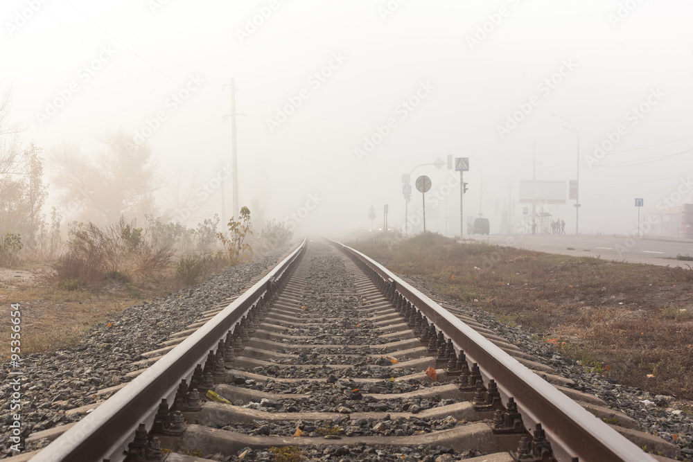 Railways at foggy weather morning