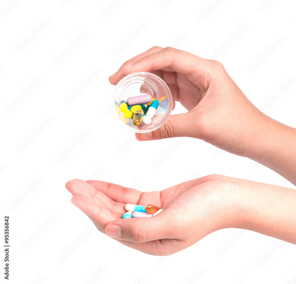 Druge capsules and pills in hand Druge capsules and pills in hand