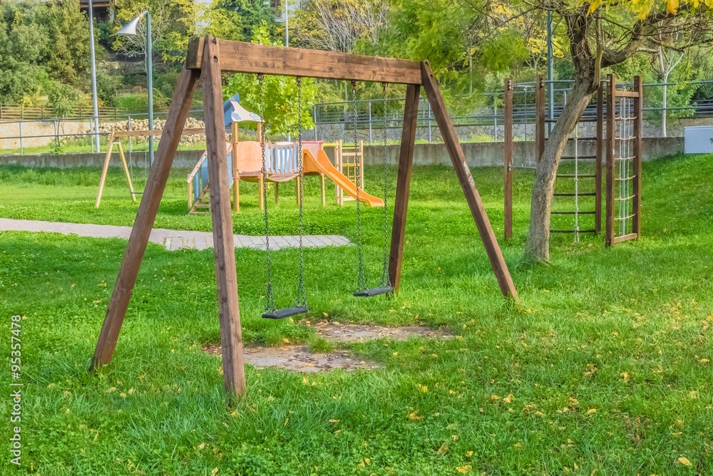 empty swings at playground for child near children stairs slides equipment empty swings at playground for child near children stairs slides equipment