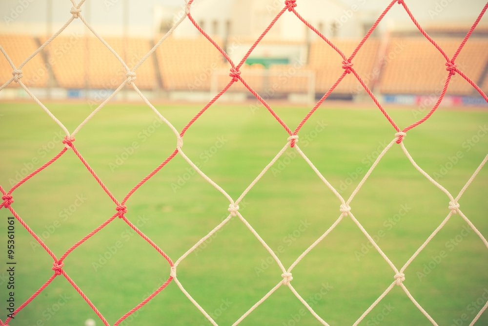 Fototapeta premium blurry football and soccer goal net pattern vintage color
