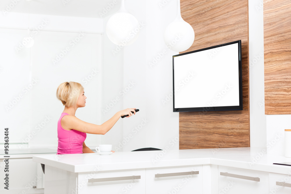 woman watching tv hold remote control woman watching tv hold remote control