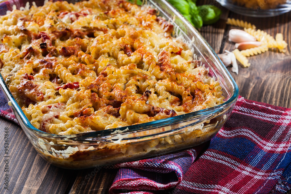 Casserole fusilli pasta with sausage, zucchini and cheese