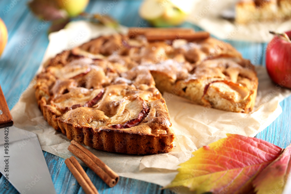 Homemade apple cake on blue wooden table Homemade apple cake on blue wooden table