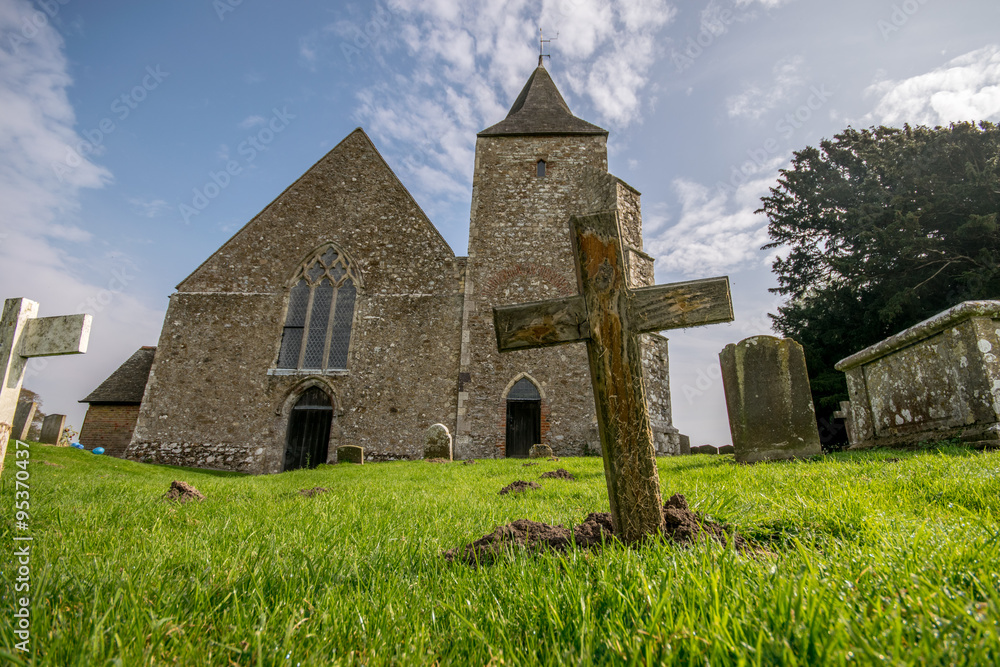 Unmarked cross in front of St Clement's church, Romney Marsh.