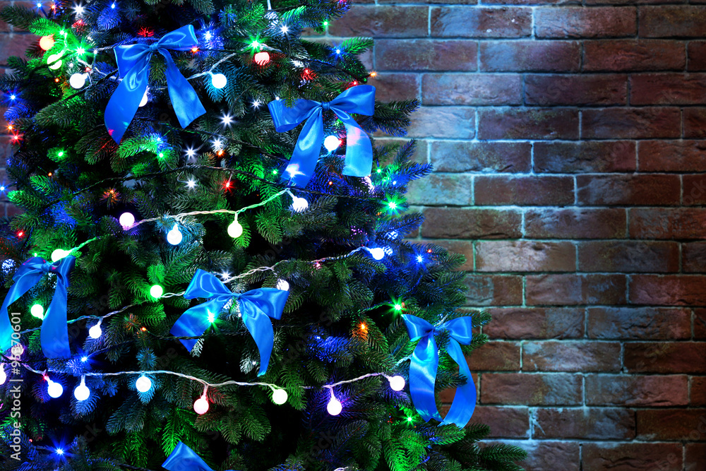 Christmas tree on brick wall background