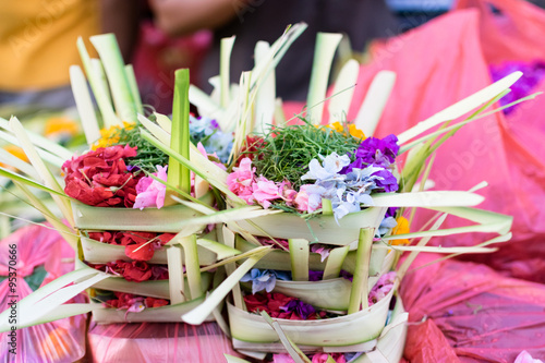 Canang Sari in Bali / Canang (Canang sari) is one of the daily offerings made by Balinese Hindus to thank the Sang Hyang Widhi Wasa in praise and prayer.  photo