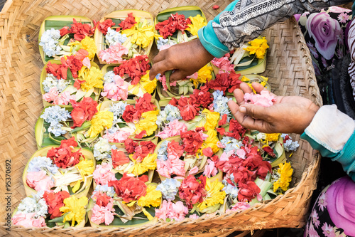 Canang Sari in Bali / Canang (Canang sari) is one of the daily offerings made by Balinese Hindus to thank the Sang Hyang Widhi Wasa in praise and prayer.  photo