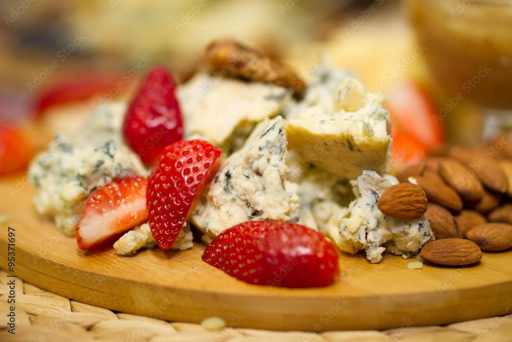 Fototapeta premium Still life picture with cheese and strawberries