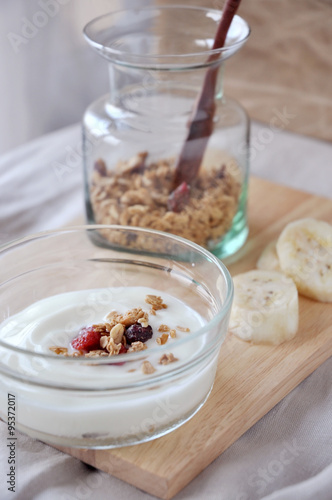yogurt bowl with granola on background