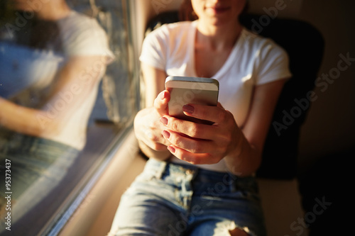 young casual woman using smart phone  at home.