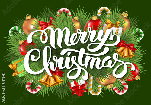 Merry Christmas card with calligraphy inscription, spruce branches and different decorations -  christmas balls, gift boxes and candy canes. Green background. Vector illustration.