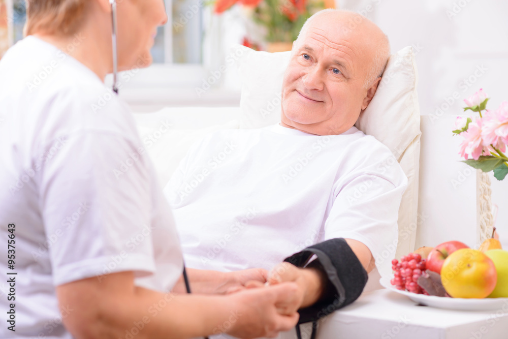 Fototapeta premium Nice adult couple measuring pressure 