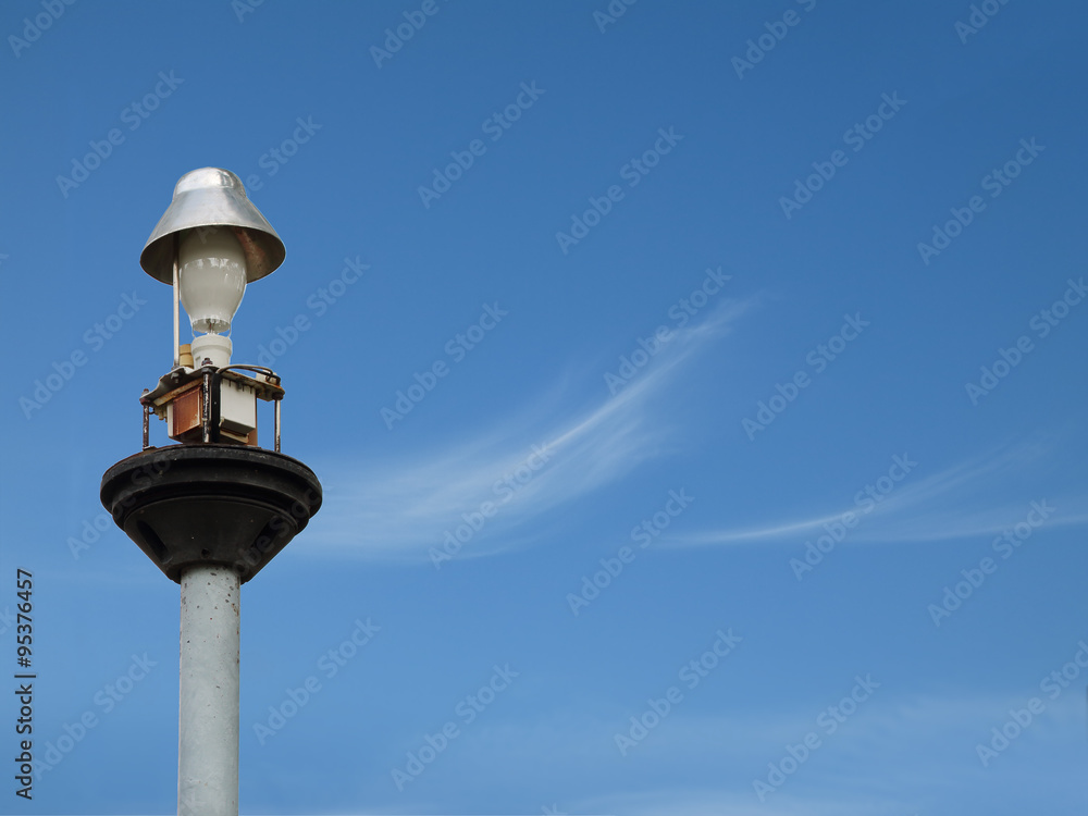 Light pole under the blue sky.