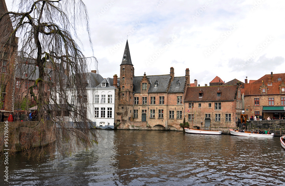 The main part of old town during a cloudy raining day in Bruges