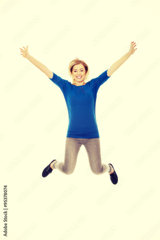 Young casual woman jumping. Young casual woman jumping.