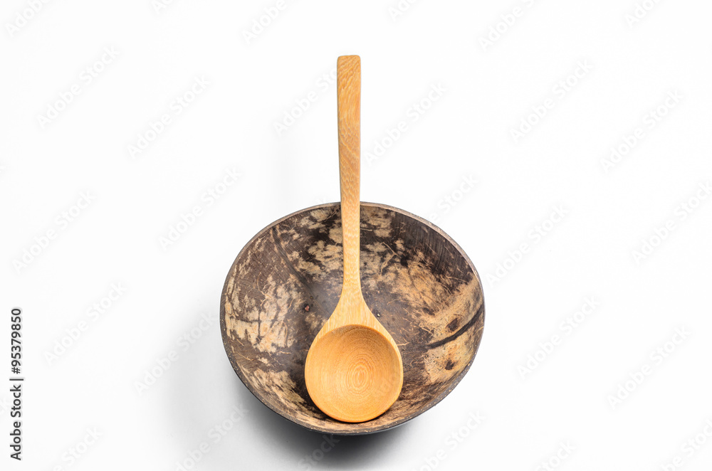 bowl made from Coconut shell with wooden spoon on white background bowl made from Coconut shell with wooden spoon on white background