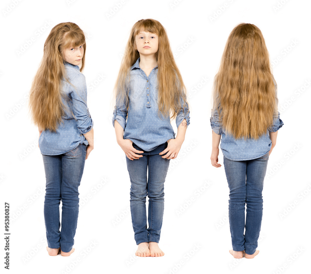 A little girl with long hair in jeans. A little girl with long hair in jeans.