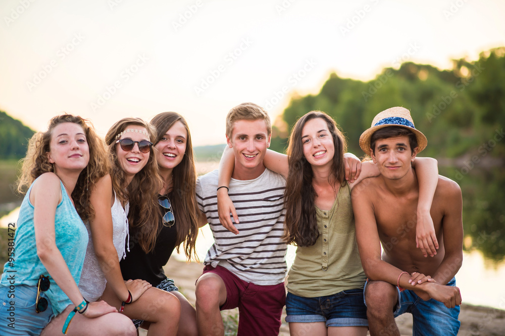 trendy teenagers on the beach at sunset, holidays, friendship trendy teenagers on the beach at sunset, holidays, friendship
