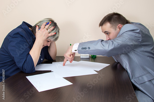 Two people sitting in office and thiking photo