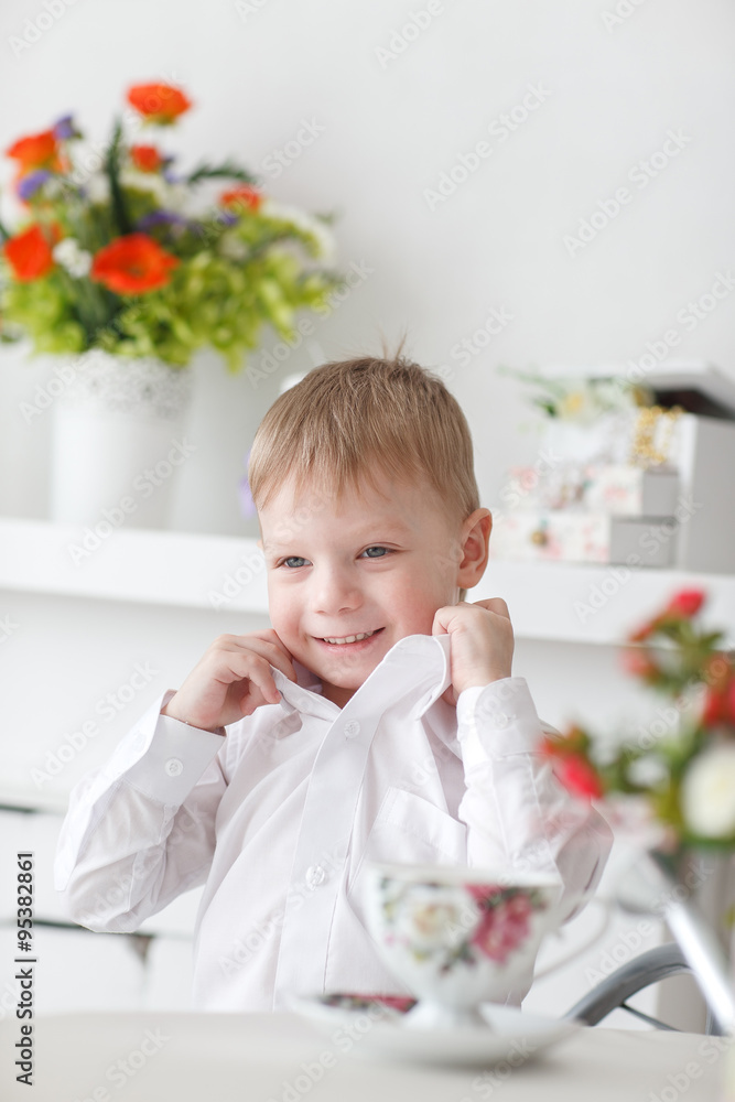 Beautiful happy blond boy holding a carrot Beautiful happy blond boy holding a carrot