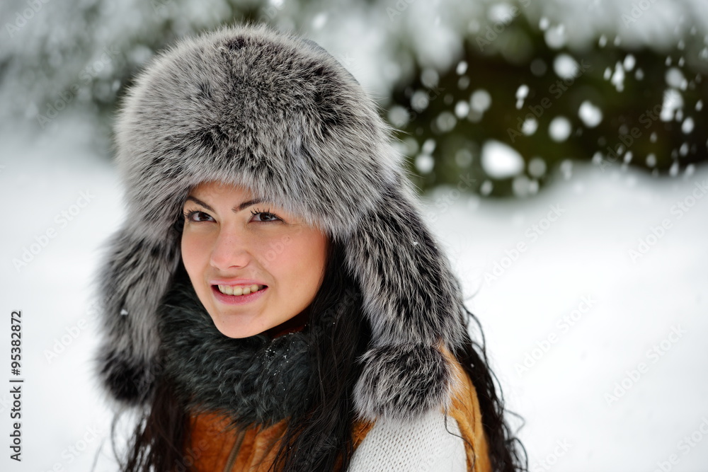 portrait of beautiful smiling female in luxurious fur head cloth portrait of beautiful smiling female in luxurious fur head cloth