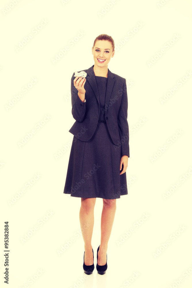 Business woman holding airplane model. Business woman holding airplane model.