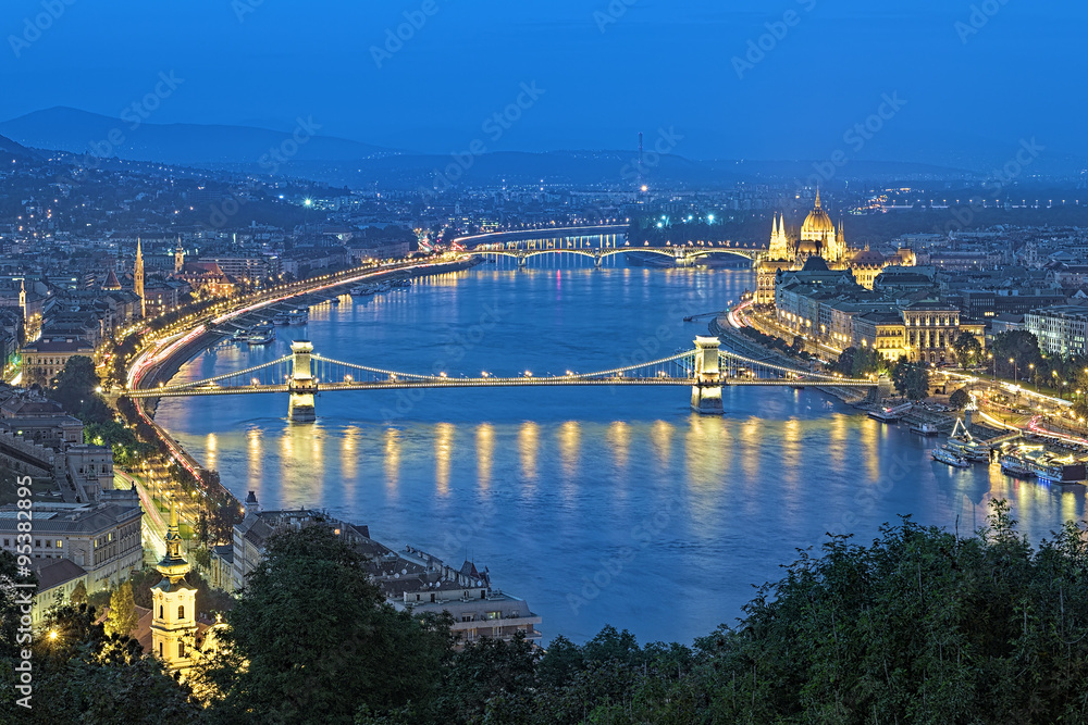 Evening view of Danube with Szechenyi Chain Bridge and Hungarian Parliament Building from Gellert Hill in Budapest, Hungary