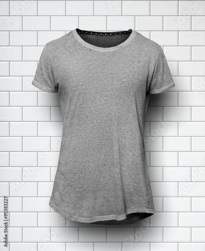 Gray tshirt isolated and wall of the bricks background photo