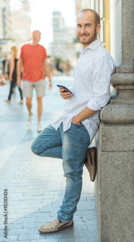 Cheerful man with phone