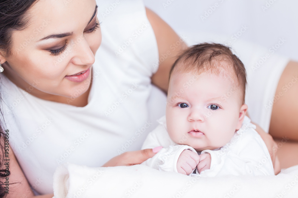 Young happy beautiful mother with her little baby Young happy beautiful mother with her little baby