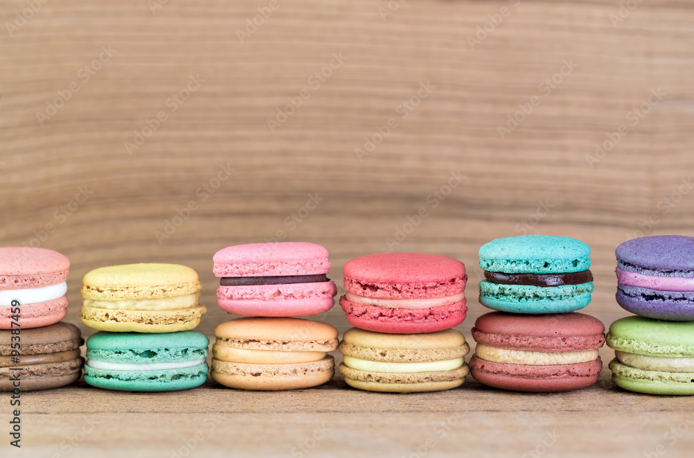 Fototapeta premium Stack Focus Image Of Colorful French Macarons On Wooden backgrou